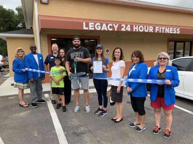 Cody Neer cutting the ribbon at the opening of his gym, Legacy 24 Hour Fitness